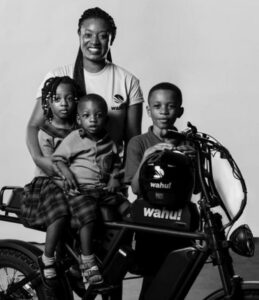 Valerie Labi, her three children, and the ebike 